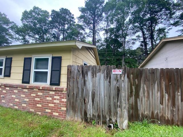 3804 Arapaho Trl, Little Rock, AR 72209 - view of property exterior featuring brick siding and fence