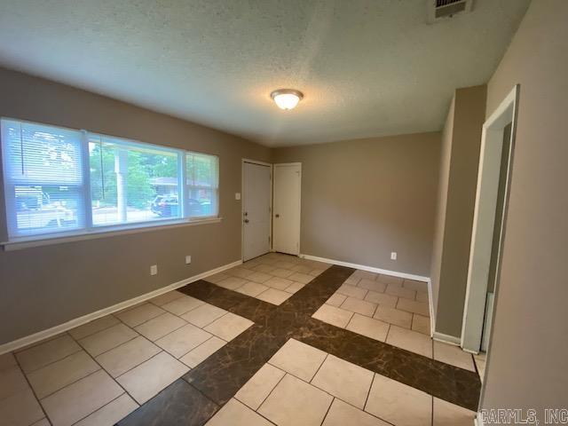 3804 Arapaho Trl, Little Rock, AR 72209 - spare room with baseboards and inlaid floor details