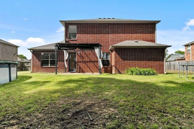 rear view of house with brick siding