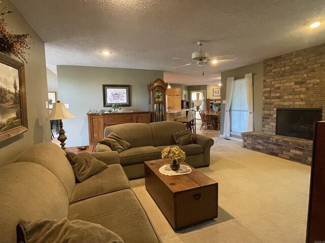 1502 Quail Creek Dr, Conway, AR 72032 - living area featuring a textured ceiling, light colored carpet, a ceiling fan, and a brick fireplace