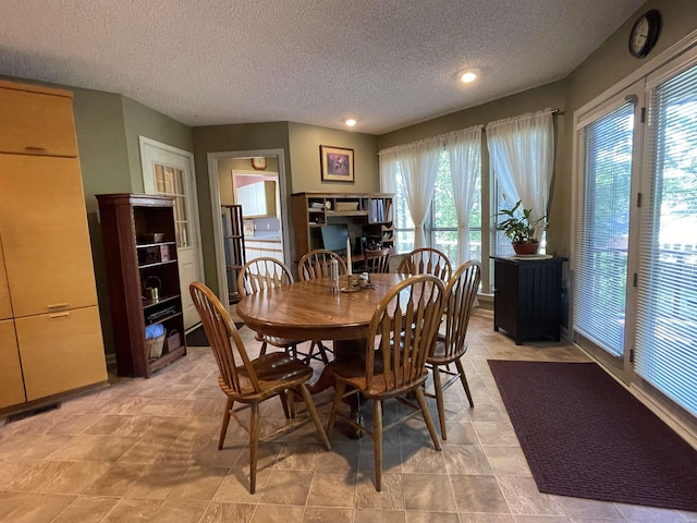 1502 Quail Creek Dr, Conway, AR 72032 - dining area featuring a textured ceiling and recessed lighting