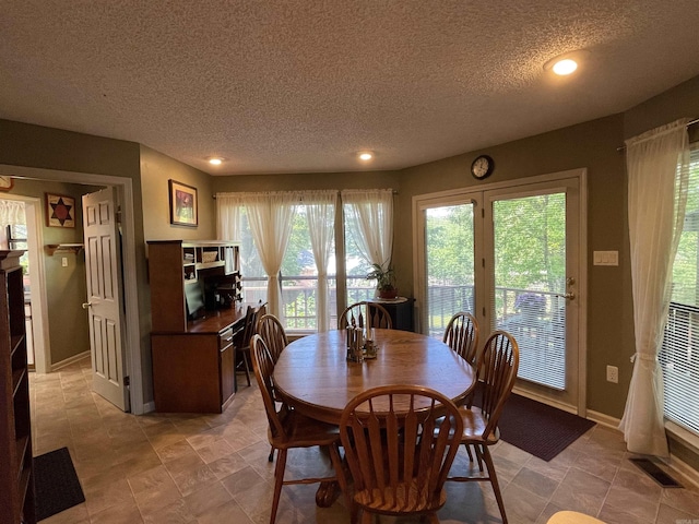 1502 Quail Creek Dr, Conway, AR 72032 - dining space with a textured ceiling, recessed lighting, and baseboards