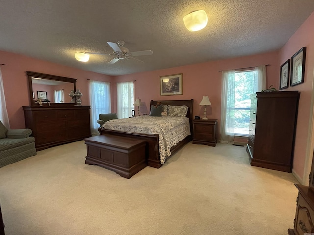 1502 Quail Creek Dr, Conway, AR 72032 - bedroom with a textured ceiling, light colored carpet, ceiling fan, and baseboards