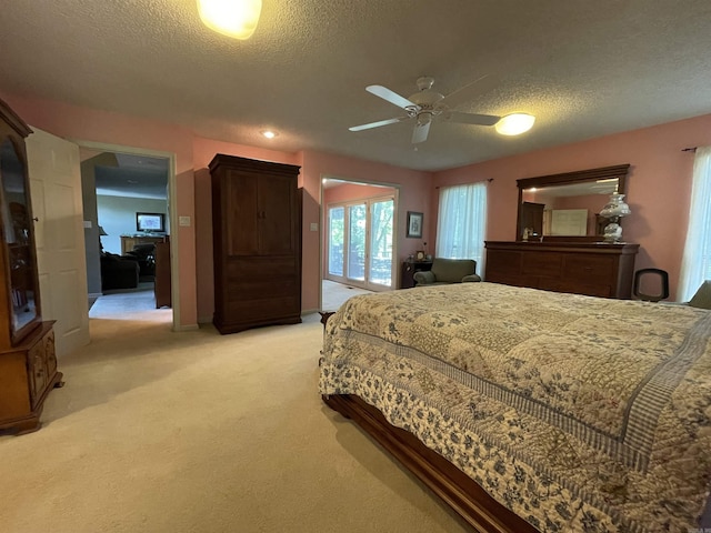 1502 Quail Creek Dr, Conway, AR 72032 - bedroom with light colored carpet, access to exterior, a textured ceiling, and ceiling fan