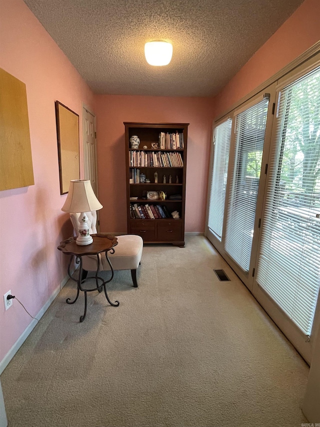 1502 Quail Creek Dr, Conway, AR 72032 - living area with a textured ceiling and carpet