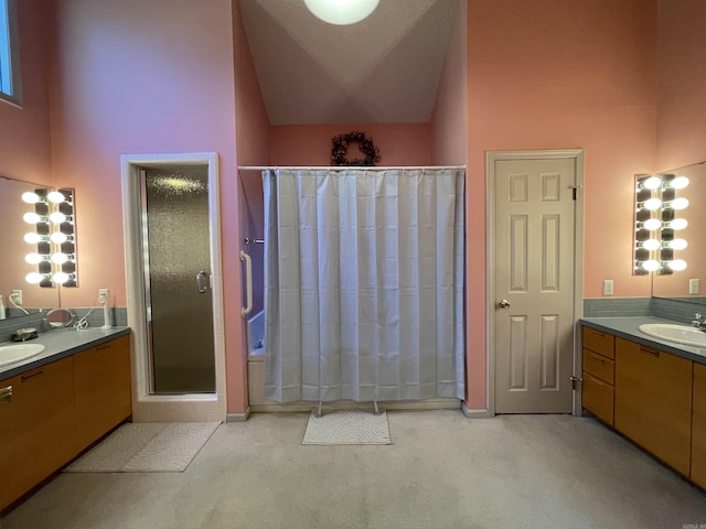1502 Quail Creek Dr, Conway, AR 72032 - full bath featuring a shower stall, a high ceiling, two vanities, and baseboards
