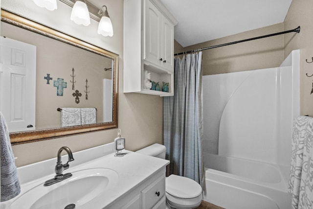 bathroom featuring toilet, shower / tub combo with curtain, and vanity