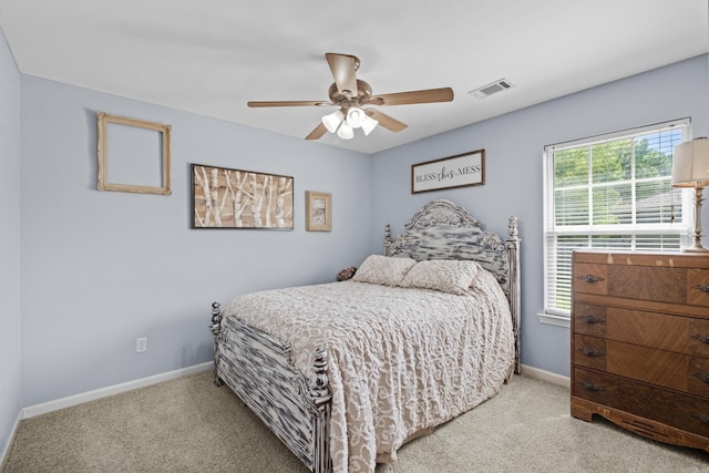 bedroom with light carpet, baseboards, and ceiling fan
