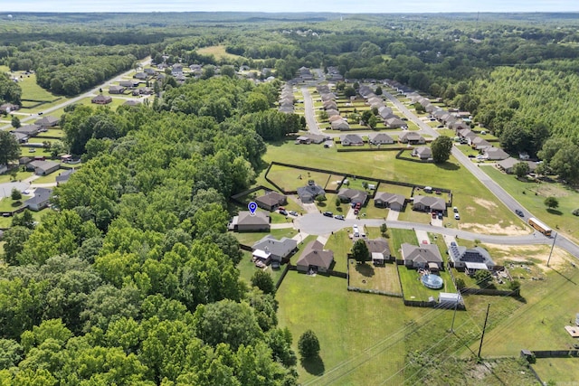 aerial perspective of suburban area with a heavily wooded area