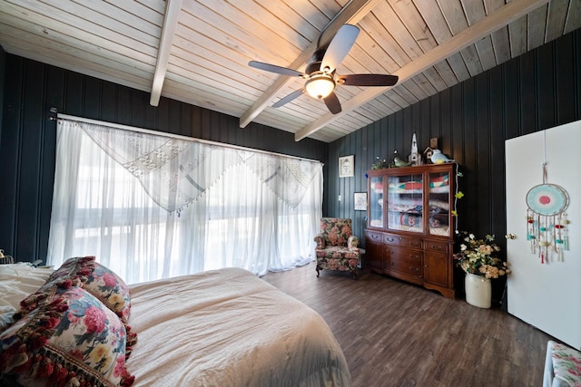 107 W Sunset, Sheridan, AR 72150 - bedroom featuring multiple windows, beamed ceiling, wood finished floors, a ceiling fan, and wood walls