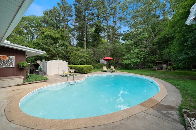 107 W Sunset, Sheridan, AR 72150 - swimming pool featuring a storage unit, an outbuilding, a patio, a lawn, and view of wooded area