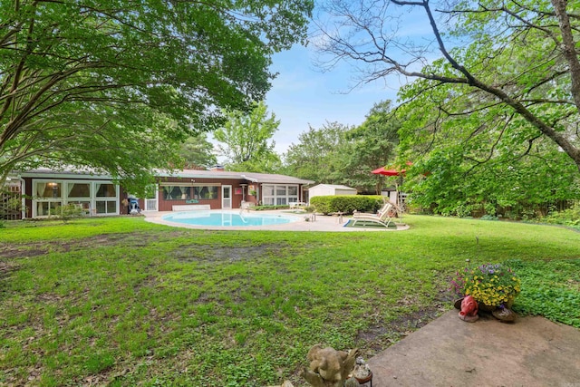 107 W Sunset, Sheridan, AR 72150 - view of green lawn featuring an outdoor pool, a patio, and a sunroom
