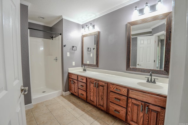 bathroom featuring ornamental molding, tile patterned flooring, double vanity, and a shower