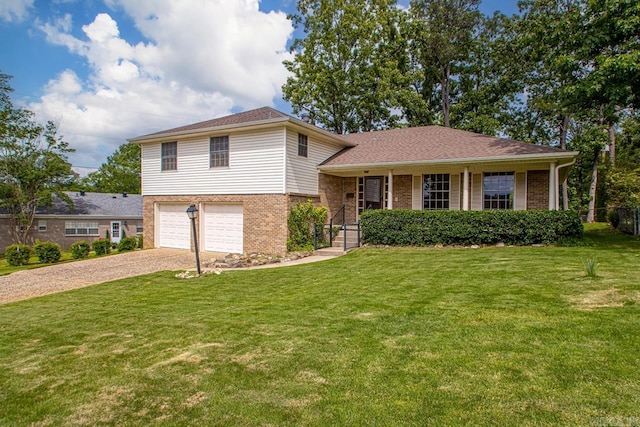 tri-level home with gravel driveway, brick siding, an attached garage, and a porch