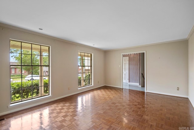 spare room featuring baseboards and ornamental molding
