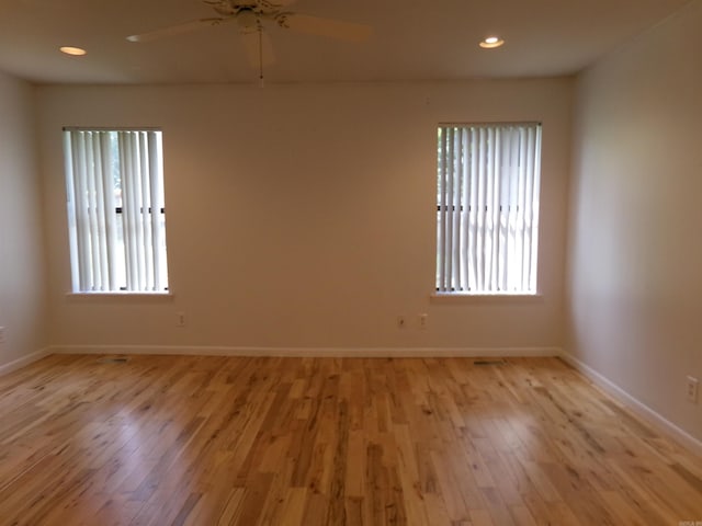 14301 Ridgewood, Little Rock, AR 72211 - unfurnished room featuring light wood-style floors, a ceiling fan, baseboards, and recessed lighting