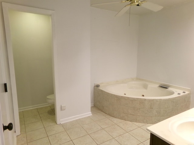 14301 Ridgewood, Little Rock, AR 72211 - bathroom featuring tile patterned floors, a tub with jets, ceiling fan, vanity, and toilet