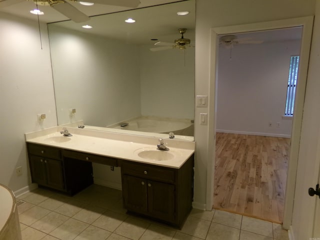 14301 Ridgewood, Little Rock, AR 72211 - full bathroom featuring ceiling fan, tile patterned floors, a garden tub, baseboards, and recessed lighting