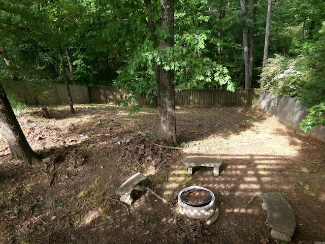 14301 Ridgewood, Little Rock, AR 72211 - fenced backyard with a fire pit