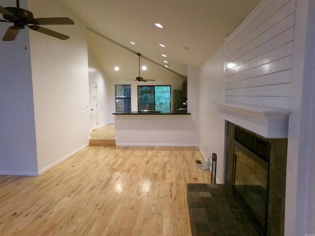 14301 Ridgewood, Little Rock, AR 72211 - unfurnished living room with ceiling fan, a fireplace with flush hearth, light wood-type flooring, recessed lighting, and vaulted ceiling