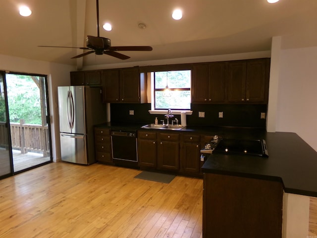 14301 Ridgewood, Little Rock, AR 72211 - kitchen featuring dishwasher, freestanding refrigerator, a sink, dark countertops, and a ceiling fan