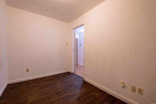 3815 Bruno Rd, Little Rock, AR 72209 - spare room featuring dark wood-type flooring and baseboards