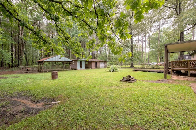 3815 Bruno Rd, Little Rock, AR 72209 - view of yard featuring an outdoor fire pit, an outbuilding, and a wooden deck
