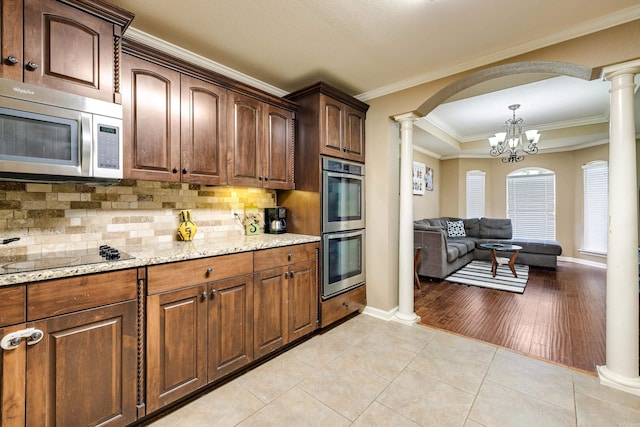 402 Demuth, Benton, AR 72019 - kitchen with stainless steel appliances, ornate columns, backsplash, ornamental molding, and light stone countertops