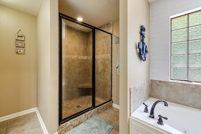 402 Demuth, Benton, AR 72019 - full bath with a shower stall, healthy amount of natural light, a garden tub, and tile patterned flooring