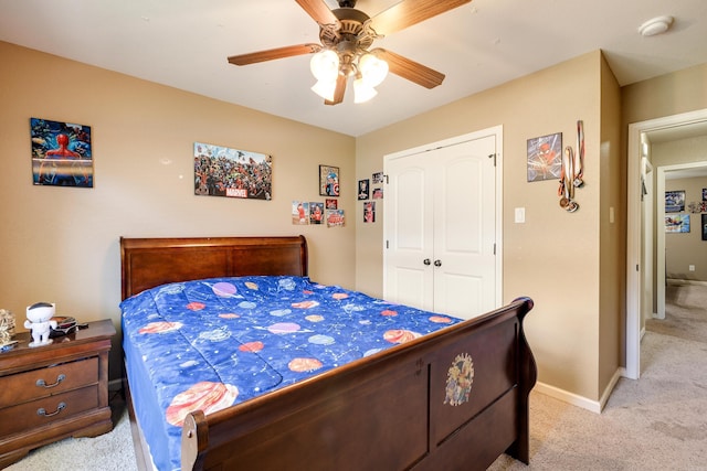 402 Demuth, Benton, AR 72019 - bedroom featuring light colored carpet, ceiling fan, a closet, and baseboards