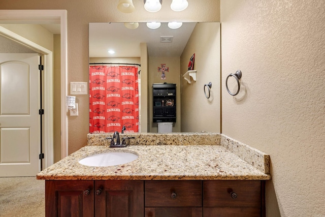 402 Demuth, Benton, AR 72019 - bathroom with a textured wall and vanity