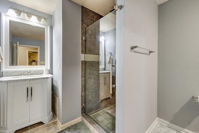 402 Demuth, Benton, AR 72019 - bathroom featuring a stall shower, vanity, and baseboards