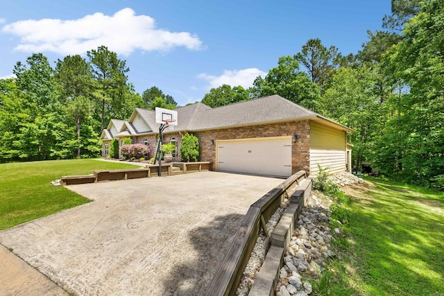 402 Demuth, Benton, AR 72019 - view of front of home featuring a front lawn, a garage, a shingled roof, stone siding, and concrete driveway