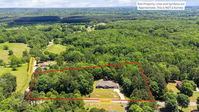 402 Demuth, Benton, AR 72019 - aerial view of property and surrounding area with a heavily wooded area and property parcel outlined