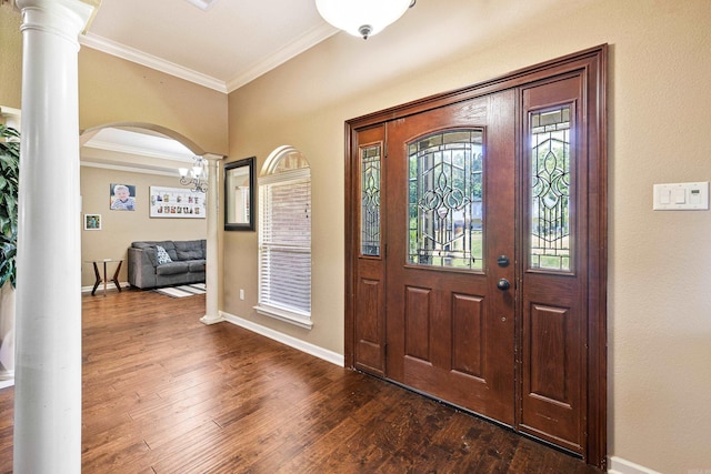 402 Demuth, Benton, AR 72019 - foyer featuring ornamental molding, arched walkways, dark wood-style floors, baseboards, and ornate columns