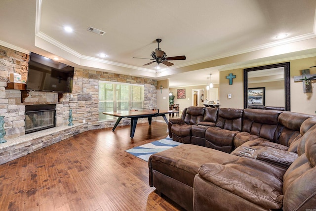 402 Demuth, Benton, AR 72019 - living area featuring crown molding, ceiling fan, wood finished floors, and a fireplace