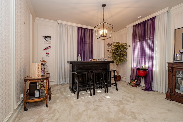 1705 W Cedar St, El Dorado, AR 71730 - carpeted dining area featuring a chandelier, wallpapered walls, and crown molding