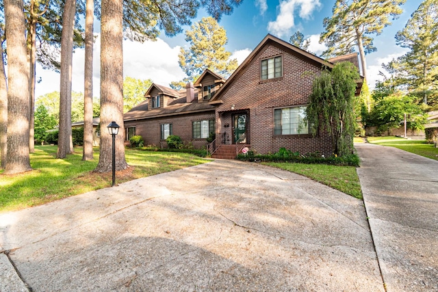 1705 W Cedar St, El Dorado, AR 71730 - view of front of house with brick siding and a front yard
