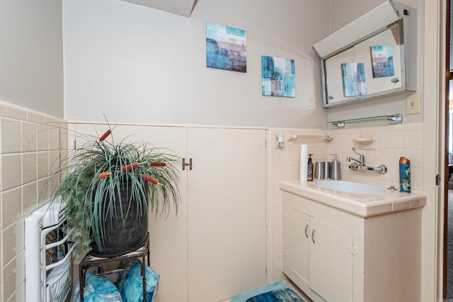 1705 W Cedar St, El Dorado, AR 71730 - bathroom featuring vanity, tile walls, and tasteful backsplash