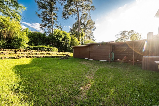 1705 W Cedar St, El Dorado, AR 71730 - view of grassy yard with central air condition unit
