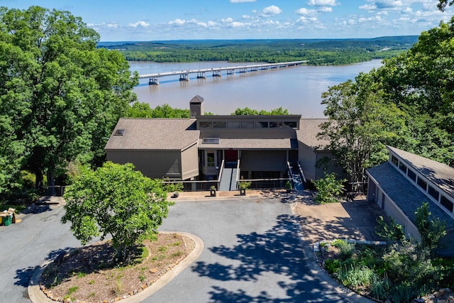 1 Rivers Edge Dr, Little Rock, AR 72227 - aerial view of property and surrounding area with a nearby body of water, a notable bridge, and a heavily wooded area