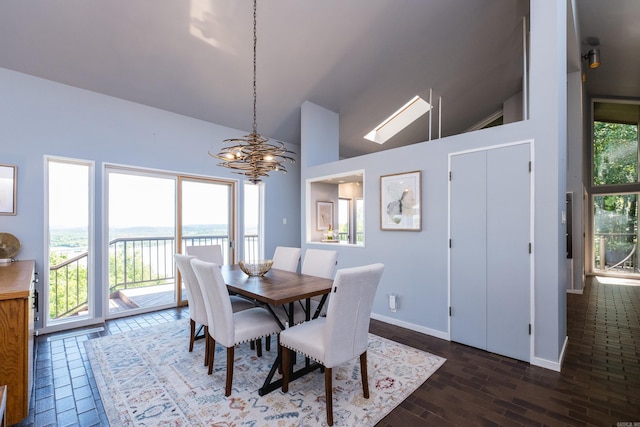 1 Rivers Edge Dr, Little Rock, AR 72227 - dining room featuring a chandelier, wood finished floors, baseboards, and high vaulted ceiling