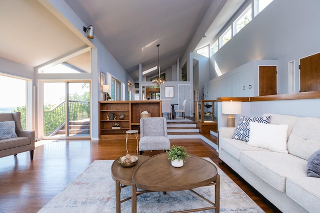 1 Rivers Edge Dr, Little Rock, AR 72227 - living area with high vaulted ceiling, a chandelier, and wood finished floors