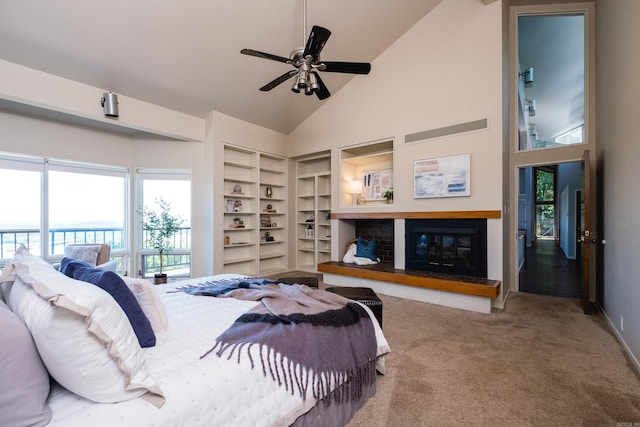 1 Rivers Edge Dr, Little Rock, AR 72227 - carpeted bedroom featuring high vaulted ceiling, a glass covered fireplace, and ceiling fan