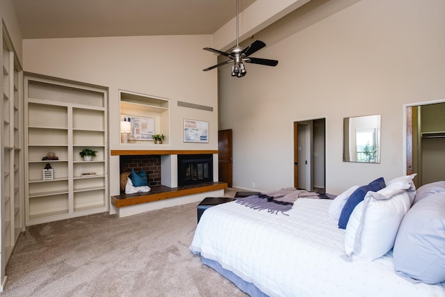 1 Rivers Edge Dr, Little Rock, AR 72227 - bedroom featuring high vaulted ceiling, carpet, a glass covered fireplace, and ceiling fan