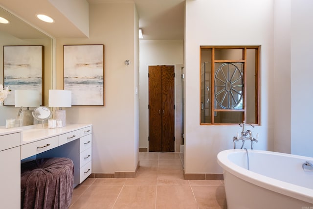 1 Rivers Edge Dr, Little Rock, AR 72227 - full bath with baseboards, a freestanding bath, vanity, and tile patterned floors