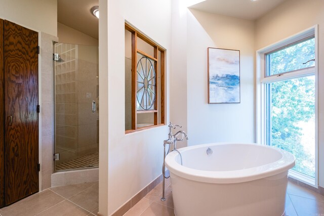 1 Rivers Edge Dr, Little Rock, AR 72227 - full bath with tile patterned flooring, a shower stall, healthy amount of natural light, and a freestanding tub