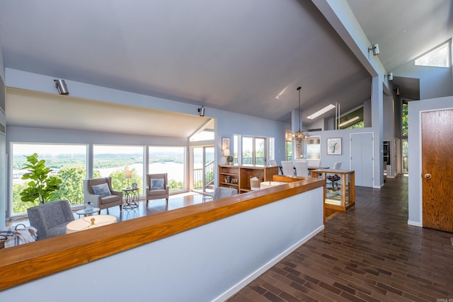 1 Rivers Edge Dr, Little Rock, AR 72227 - kitchen with a chandelier, plenty of natural light, decorative light fixtures, high vaulted ceiling, and brick patterned flooring