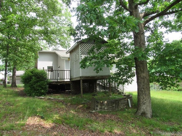 back of house featuring a deck
