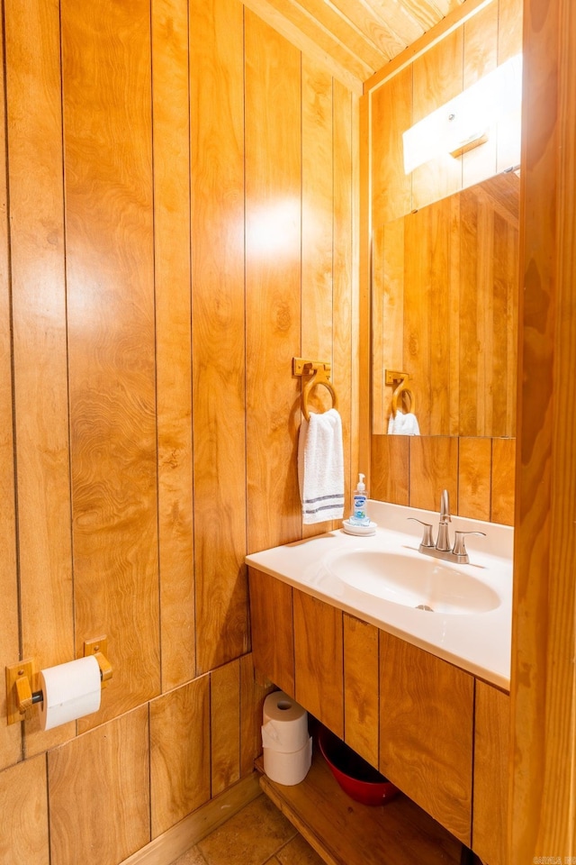 204 Riverside Dr, Pangburn, AR 72121 - bathroom with a sink, wooden walls, and tile patterned flooring